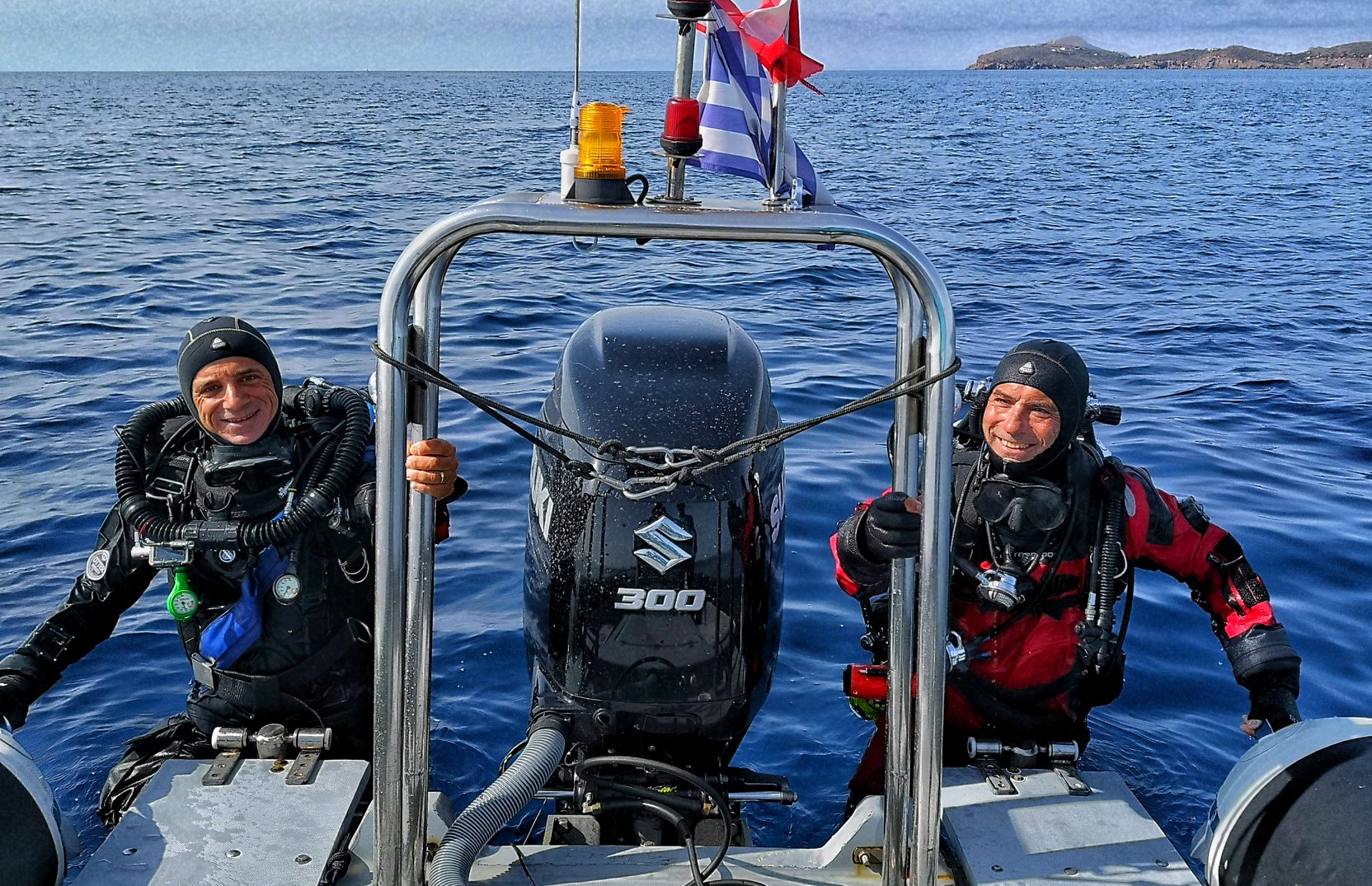 smiling tec Divers climbing the ladder back on the rib boat