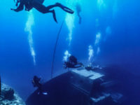 37969541_10156007505042690_264964156057190400_n divers hovering above a wreck on its side