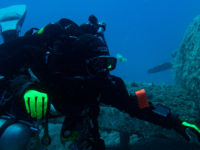 IMG_0917 rebreather diver hovering next to a small airplane